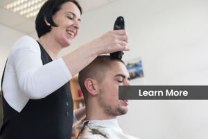 Adult Woman Workinf in Hair Salon Cutting Young Man's Hair.
